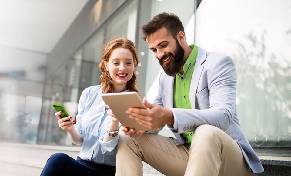 Business people looking at an ipad.